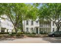 Street view of an attractive two-story townhouse with a covered porch and well-maintained landscaping at 1563 Common Way Rd, Orlando, FL 32814