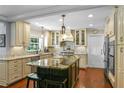 A spacious kitchen with granite counters, island, and modern stainless steel appliances at 1621 Chippewa Trl, Maitland, FL 32751