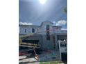 Exterior view of home during the construction phase, showing the framing and Tyvek weather barrier at 1803 Florinda Dr, Orlando, FL 32804