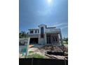 Modern home under construction features a unique design, large windows, and a spacious garage at 1803 Florinda Dr, Orlando, FL 32804