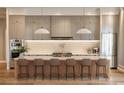 Chef's kitchen featuring stainless steel appliances, an oversized island, and modern pendant lights at 1803 Florinda Dr, Orlando, FL 32804