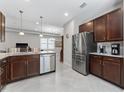 Open concept kitchen featuring stainless appliances, granite countertops and sleek cabinetry at 193 Old Moss Cir, Deland, FL 32724