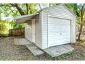 Detached garage with single door and side awning, nestled among trees at 2509 Formosa Ave, Orlando, FL 32804