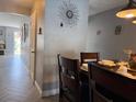 Features a dining table and hardwood floors, creating a welcoming and stylish dining space at 3024 Natoma Way, Orlando, FL 32825