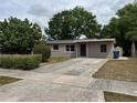 Cozy home with a neatly kept lawn, quaint landscaping, and a private driveway at 701 N 4Th St, Haines City, FL 33844