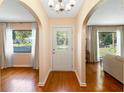 Welcoming foyer with hardwood floors, arched doorways, and a view of the living spaces at 718 31St St, Orlando, FL 32805