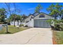 Charming one-story home with attached garage, well-maintained lawn and landscaping at 1311 Harbour Dr, Longwood, FL 32750