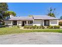 Well maintained one story home with manicured lawn, charming picket fence, and beautifully landscaped front yard at 257 Donegal Ct, Altamonte Springs, FL 32714