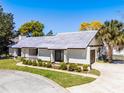 Beautiful single-story home with a well-kept lawn and charming white picket fence and mature landscaping at 257 Donegal Ct, Altamonte Springs, FL 32714