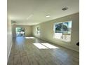 Bright, spacious living room featuring tile flooring, neutral walls, and ample natural light at 3513 Westland Dr, Orlando, FL 32818