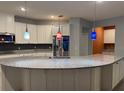 A large, modern kitchen features granite countertops, an island, and stainless steel appliances at 4036 Parkhouse Dr, Orlando, FL 32824