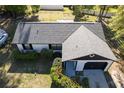 Aerial view of a single-Gathering home with a well-maintained roof, tidy yard, and an attached one-car garage at 6713 Cherry Rd, Ocala, FL 34472