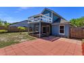 View of the patio, screened in lanai, second story deck, and fenced backyard at 787 E Charing Cross Cir, Lake Mary, FL 32746