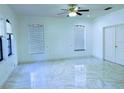Bright and airy bedroom features marble floors, neutral walls, and large windows for ample natural light at 871 Blairmont Ln, Lake Mary, FL 32746