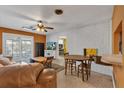 Cozy living room featuring a fireplace, wood floors, and a relaxed atmosphere at 2829 Aloma Ave, Winter Park, FL 32792