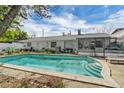 Refreshing pool with steps for easy access, surrounded by a patio and backyard at 2829 Aloma Ave, Winter Park, FL 32792