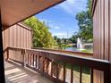 A beautiful view from the balcony overlooks a pond with a fountain on a sunny day at 1092 E Michigan St # 1, Orlando, FL 32806