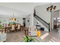Bright and airy living room with high ceilings, an open floor plan, and beautiful wood floors at 1188 Brampton Pl, Lake Mary, FL 32746