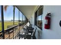 A screened porch with views of the water, along with a table and chairs for relaxing at 1600 W Lake Parker Dr # D5, Lakeland, FL 33805