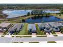 Aerial view showcases the property's prime location with lake access and well-maintained landscaping at 16781 Meadows St, Clermont, FL 34714