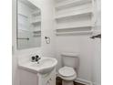 Functional half bathroom with storage shelves and a white sink at 1704 15Th St, Orange City, FL 32763