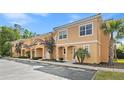 Inviting townhouse complex with well-maintained exteriors, multiple units, and convenient parking spaces at 2608 Roadster Ln, Kissimmee, FL 34746