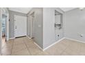 Welcoming entryway featuring neutral walls, tile flooring, and a convenient pass-through to the kitchen at 3012 S Semoran Blvd # 3, Orlando, FL 32822