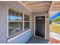 Close up of home's entry door with large windows bringing in lots of natural light at 4121 Caywood Cir, Orlando, FL 32810