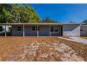 Single-story home with front porch and nice windows, landscaping ready for customization at 4121 Caywood Cir, Orlando, FL 32810