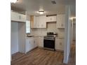 Bright kitchen with stainless steel appliances, white cabinets, and modern countertops at 444 Sunnyview Cir, Orlando, FL 32810