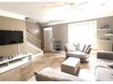 Comfortable living room with a large window for natural light and tile flooring at 6575 Time Square Ave # 101, Orlando, FL 32835