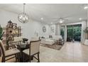 Inviting living room with stylish décor and access to an outdoor patio at 1284 Pavia Dr, Apopka, FL 32703