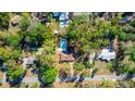 Overhead view of a home nestled in a green neighborhood, featuring a private pool at 135 Hilltop Pl, Altamonte Springs, FL 32701