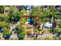 Overhead view of a home nestled in a green neighborhood, featuring a private pool at 135 Hilltop Pl, Altamonte Springs, FL 32701