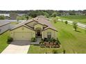 Lovely one-story home with lush landscaping, green grass, and a two car garage in a Gathering friendly neighborhood at 1924 Piedmont Ct, Mascotte, FL 34753