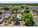 An aerial view showcasing the neighborhood with mature trees close to nearby highway and recreational area at 205 Twisting Trl, Orlando, FL 32825