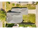 Overhead shot of the property highlighting the roof, lawn, driveway, and proximity to surrounding houses at 2531 Seabranch St, Orlando, FL 32828