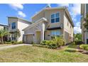Inviting home features well-maintained lawn, stone facade, and modern design elements at 2805 Bookmark Dr, Kissimmee, FL 34746