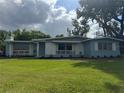 Attractive single-story home with a green lawn and charming brick accents at 3107 Troy Dr, Orlando, FL 32806