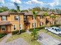 Well-maintained townhome with tropical landscaping and private driveway at 3132 Calabria Ave, Davenport, FL 33897