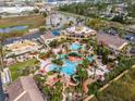 Aerial view of resort-style community pool with lazy river and amenities at 3132 Calabria Ave, Davenport, FL 33897