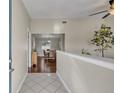 Bright foyer featuring tile flooring and a view of the dining area, creating a welcoming and airy entrance at 3236 Kayenta Ct, Orlando, FL 32829