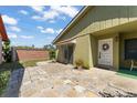 Inviting backyard patio with stone pavers and a private entrance to the home at 335 Kantor Blvd, Casselberry, FL 32707