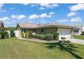 Beautiful single-story home offers a well-maintained lawn and an attached two-car garage at 335 Kantor Blvd, Casselberry, FL 32707