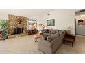 Spacious living room with stone fireplace, neutral walls, and comfortable seating at 335 Kantor Blvd, Casselberry, FL 32707