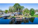 Beautiful waterfront property with a dock for boating and fishing on a clear lake at 36112 Lake Unity Rd, Fruitland Park, FL 34731