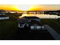 Waterfront property with amazing sunset views offering serene and picturesque living experience at 4512 Cutwater Dr, Orlando, FL 32820