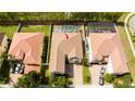 Aerial view of home featuring a screened-in pool, brown roof, and brick driveway at 6008 Golden Dewdrop Trl, Windermere, FL 34786