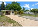 Charming single story home with a long drive, mature trees and a spacious front yard at 6031 W Ridgewood Ave, Orlando, FL 32835