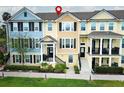 Charming townhouses featuring colorful exteriors, black shutters, and manicured landscaping for curb appeal at 1011 Cedar Bay Ln, Winter Springs, FL 32708